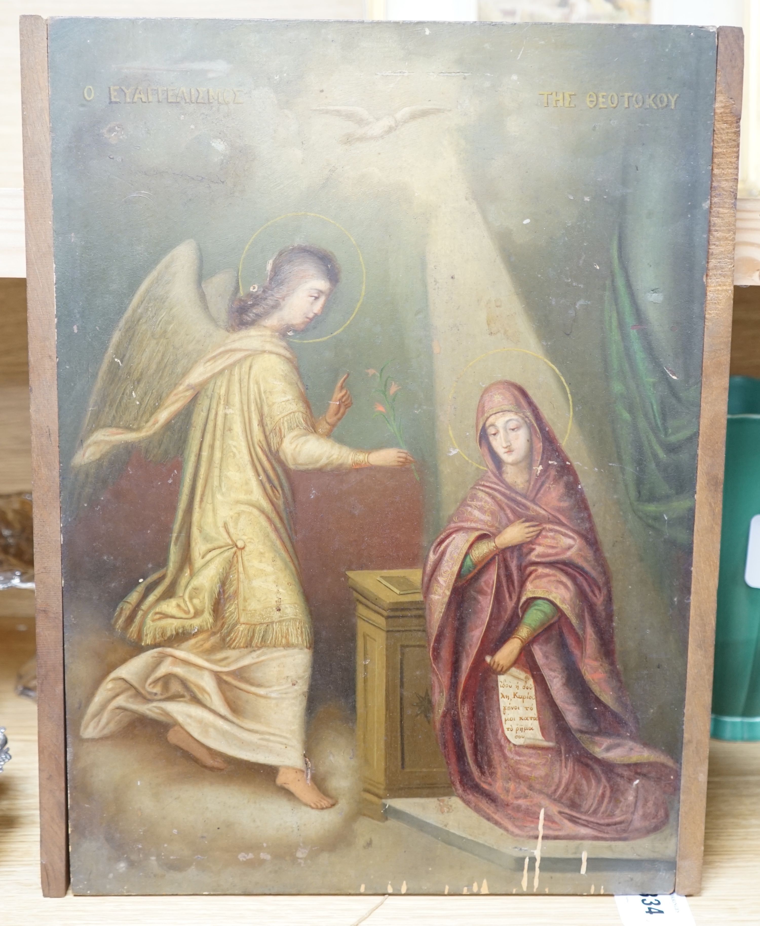 Greek School c.1900, oil on wooden panel, 'The Annunciation', inscribed in Greek, 44 x 31.5cm